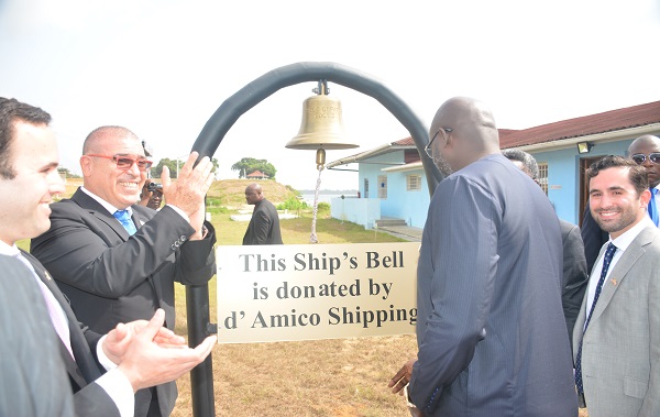 President admiring Ship's bell donated by d'Amico Shipping